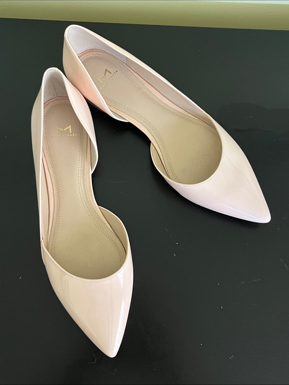 Marc Fisher LTD pointed-toe d'Orsay flats feature a minimalist design